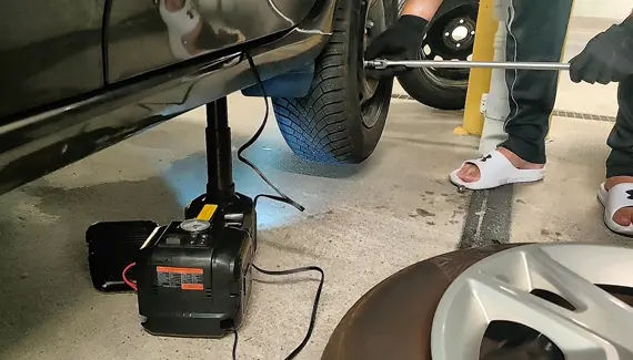 Is there any task that requires an electric car jack specifically